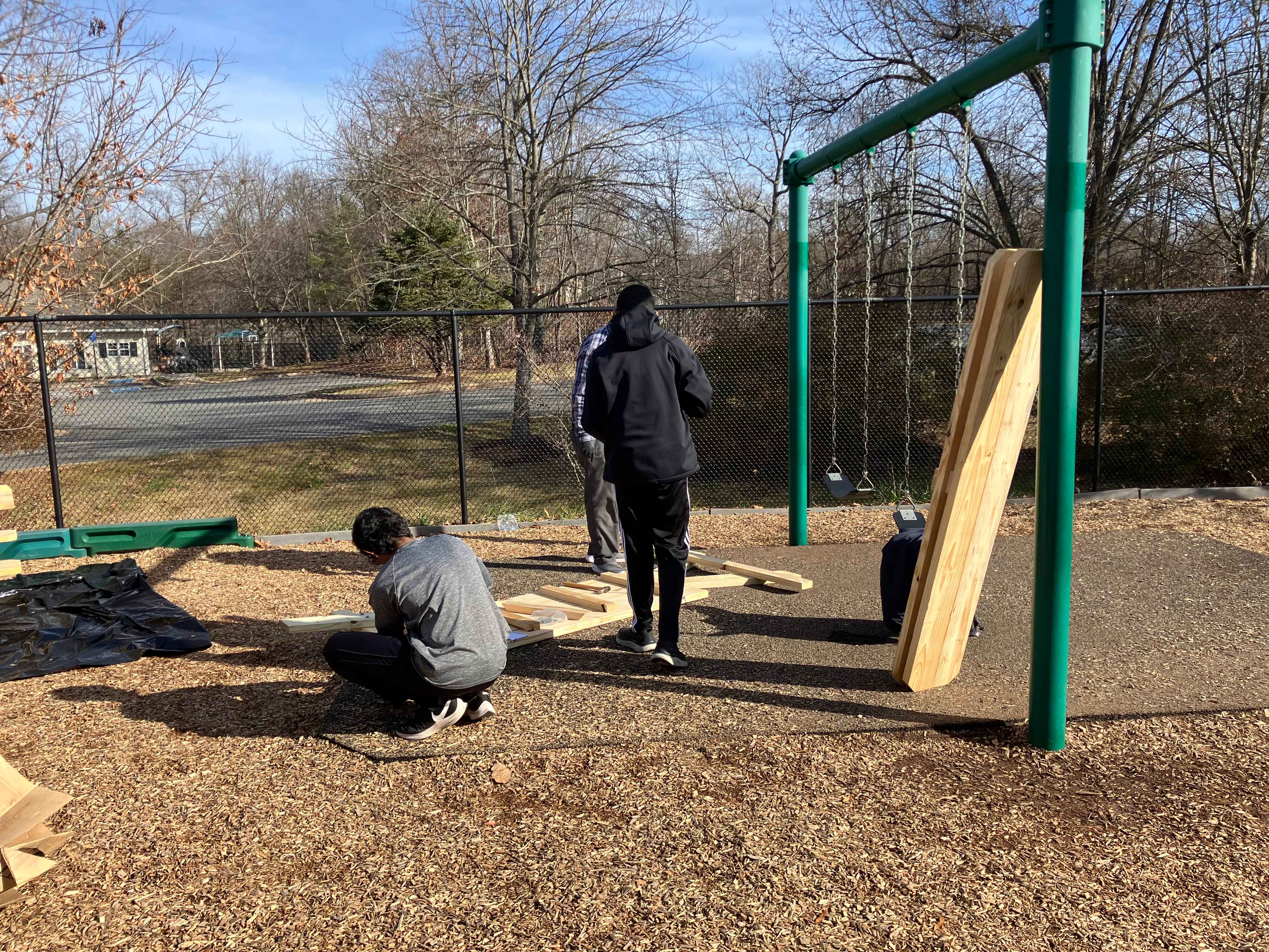 Two scouts working on tables